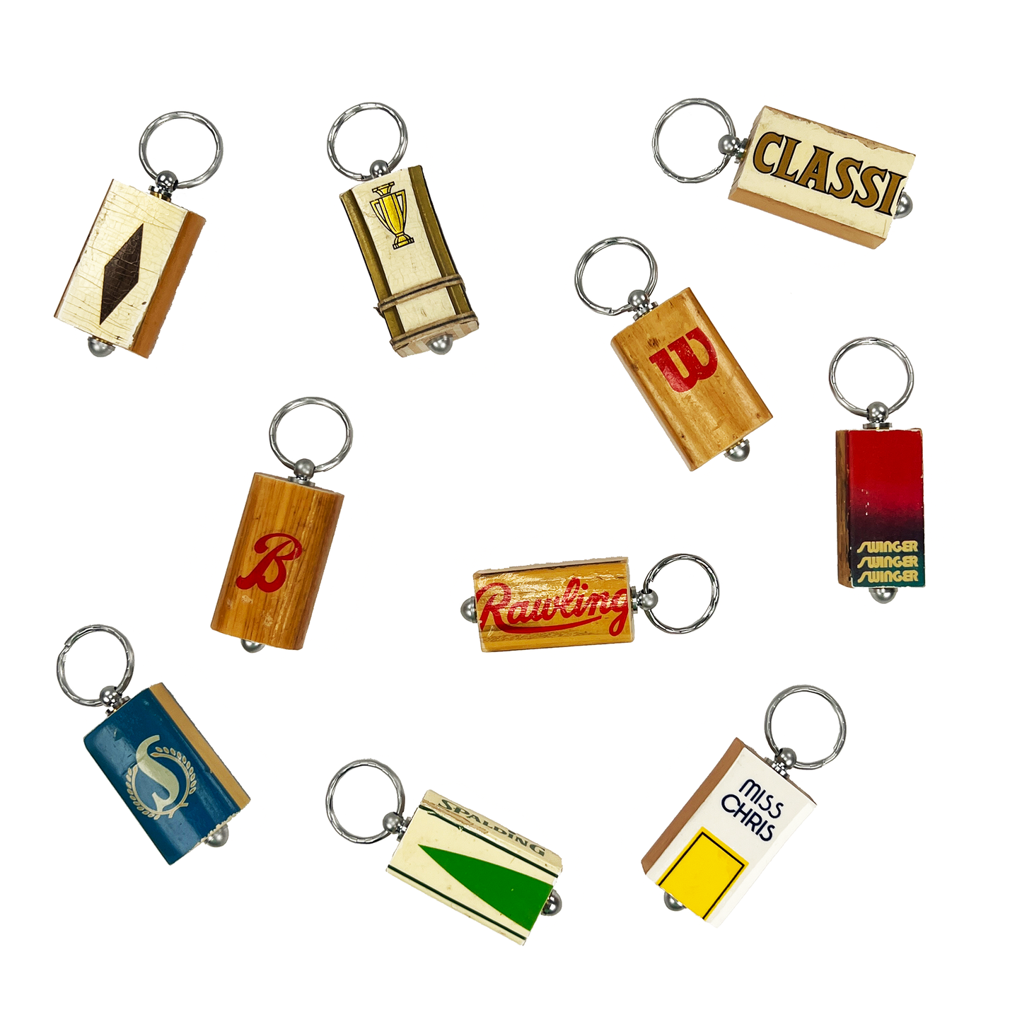 Antique tennis racquet keychain hanging on a tennis bag zipper — tennis tournament gift